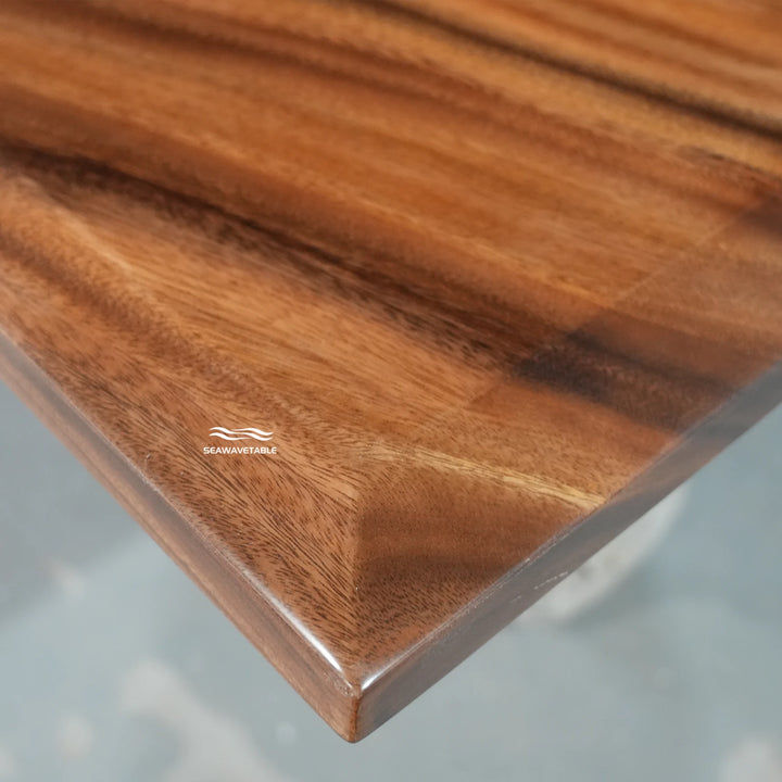 Close-up of a beveled-edge dining table showing the clean angled cut -SeawaveTable
