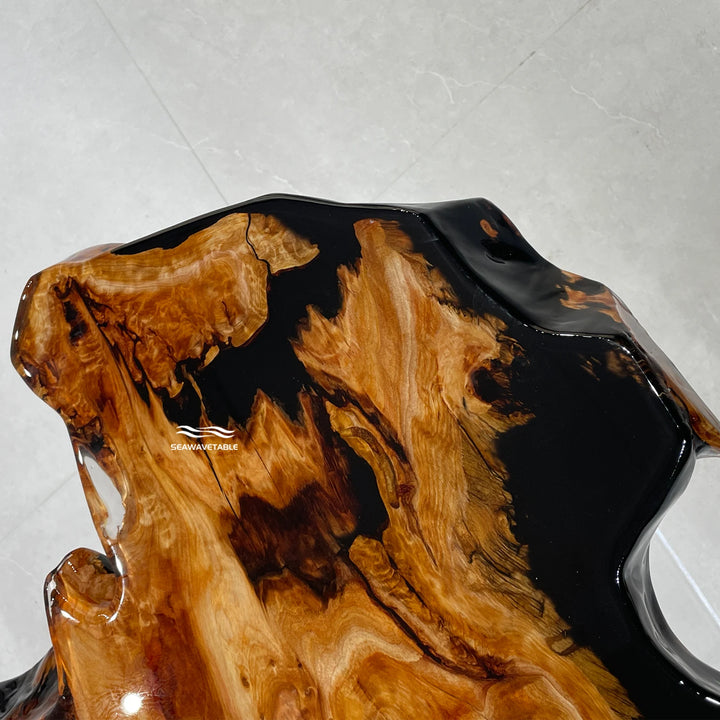 Close-up detail of a resin table showing the dark river pattern flowing through the live-edge cunninghamia wood - SeawaveTable
