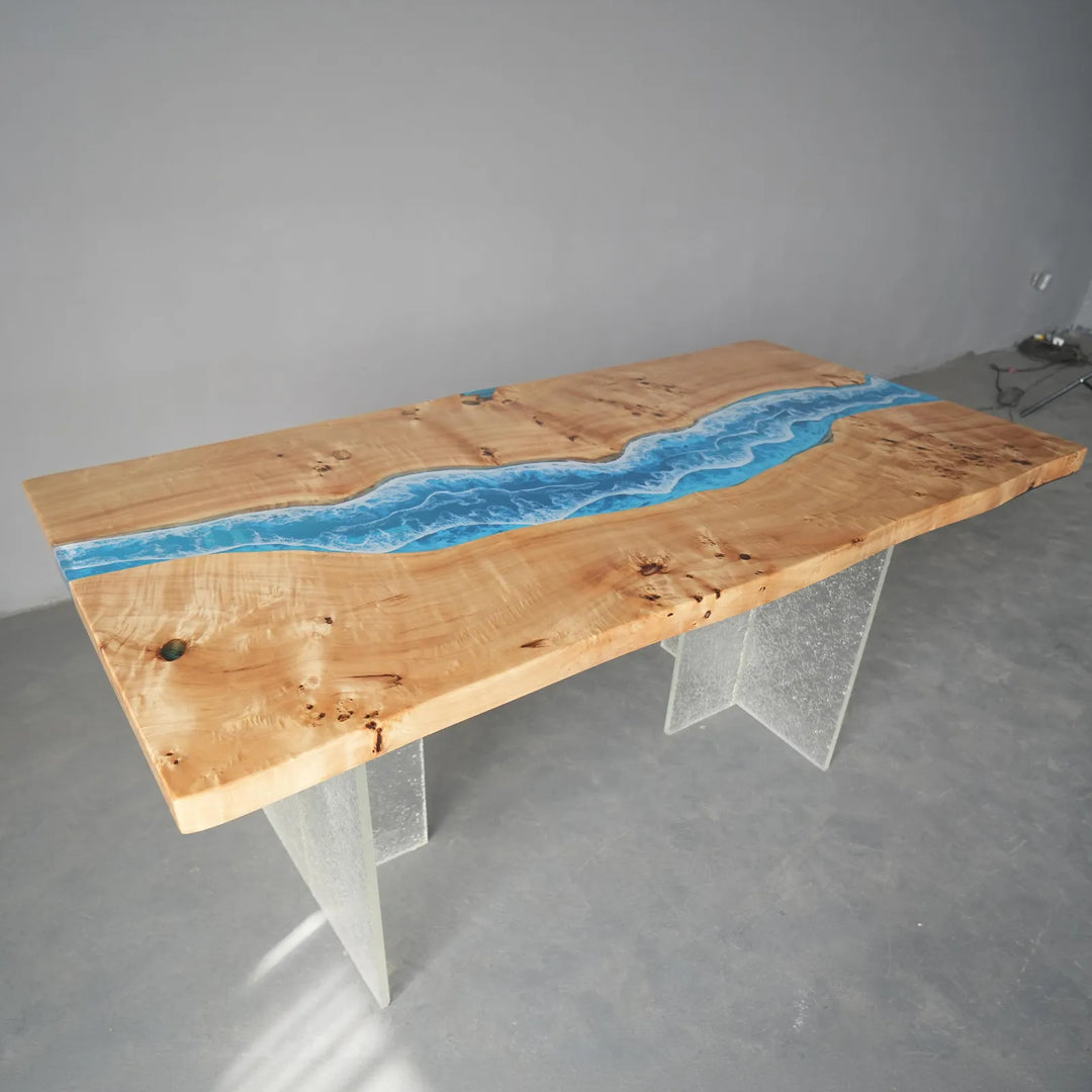 A poplar epoxy dining table exhibit highlighting the natural wood grain and vibrant blue resin channel, presented in a modern studio environment for design inspiration - SeawaveTable