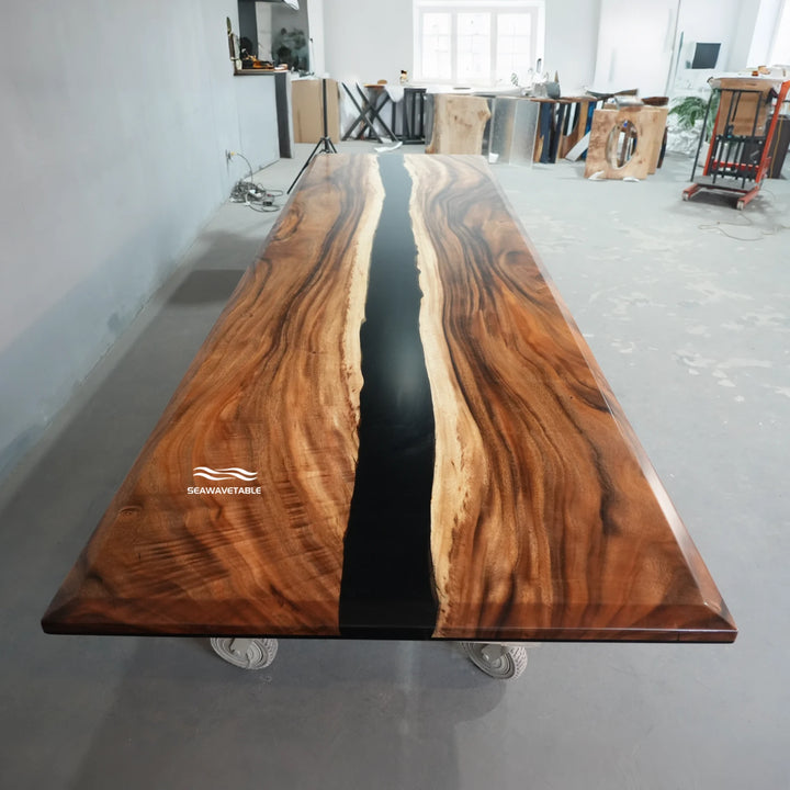 Walnut epoxy conference table exhibited in a professional showroom, highlighting the beveled-edge design, dark resin river, and premium wood grain - SeawaveTable