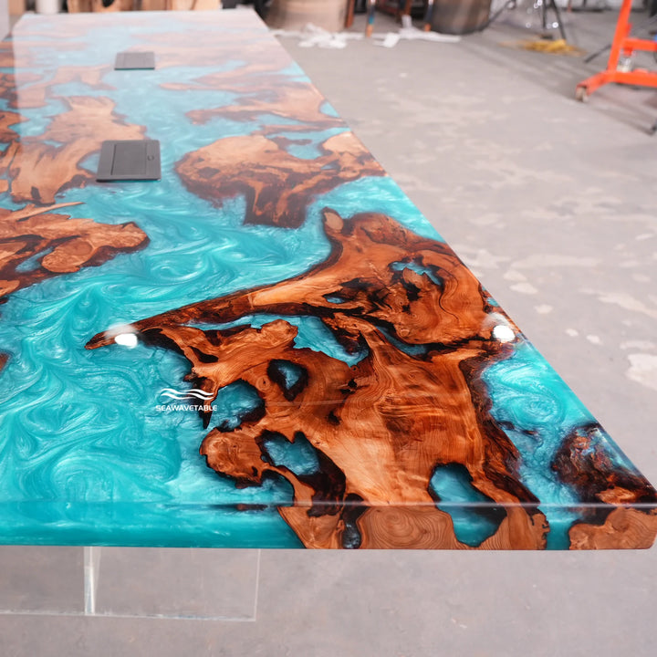 Close-up view of a Cunninghamia epoxy table featuring a glossy wood table top with deep turquoise resin patterns and natural grain details - SeaWaveTable