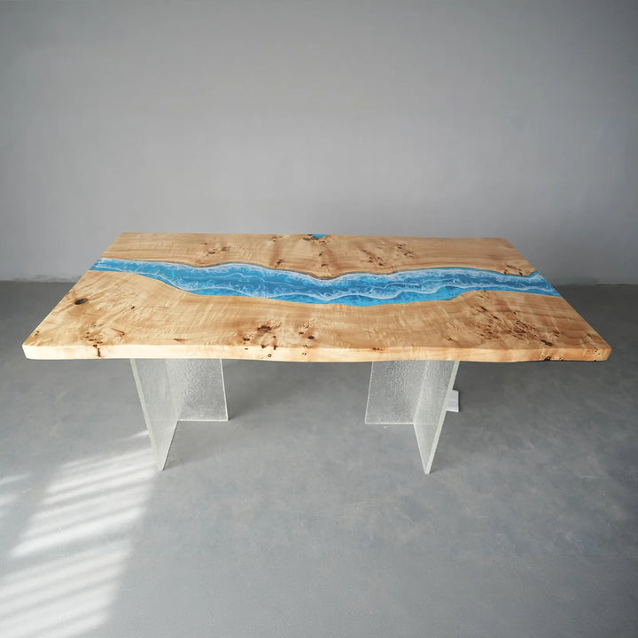 A wood dining table display featuring poplar slab with blue resin inlay, showcased in a bright studio setting for interior design presentation - SeawaveTable