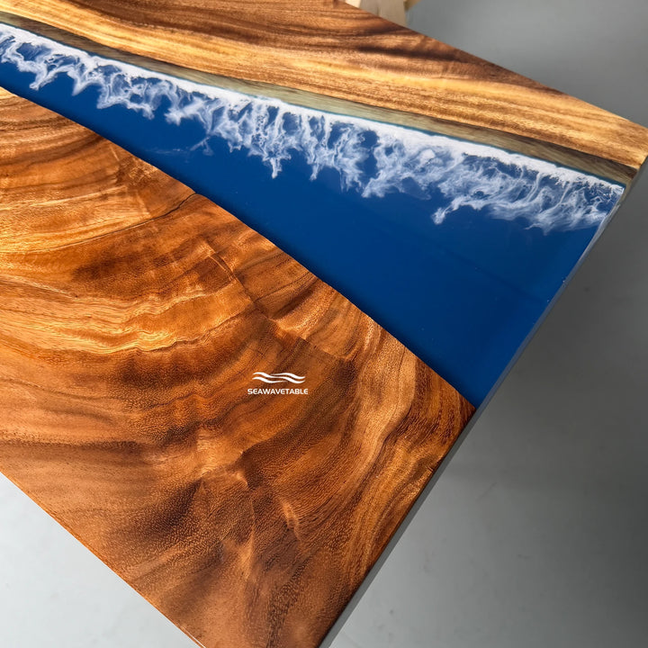 Detail of a solid wood console table highlighting the natural walnut grain texture and the glossy resin finish on the top layer - SeawaveTable