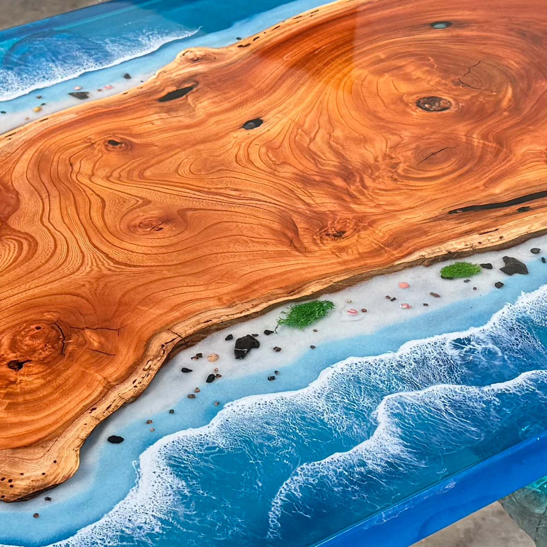 Seawavetable-Close-up of deep blue ocean resin flowing along beech wood