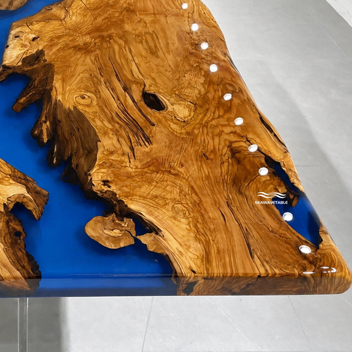 Seawavetable‑Organic live‑edge epoxy table heavy‑duty olive wood continuous blue resin river dining desk
