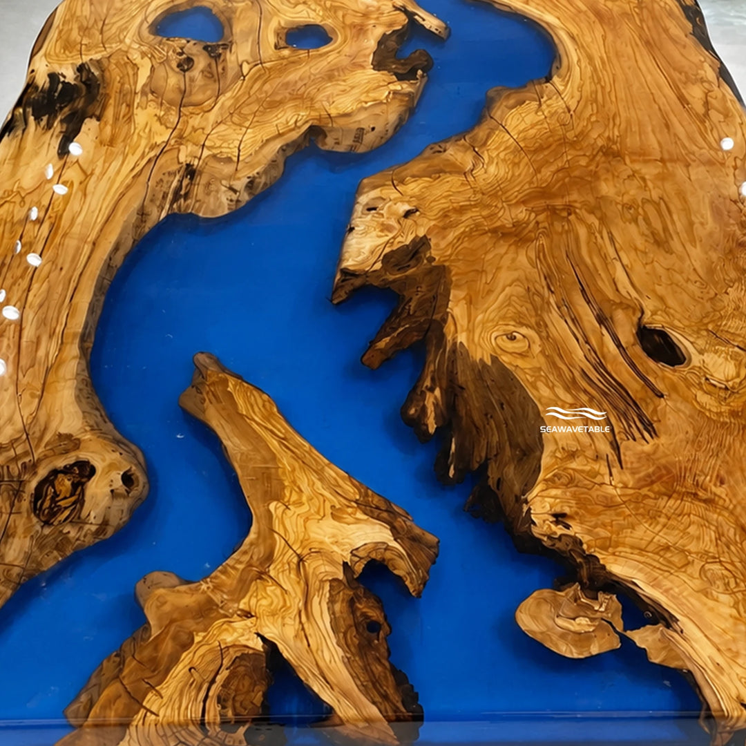 Seawavetable‑Dining room focal point epoxy dining table olive wood live‑edge with flowing royal blue resin
