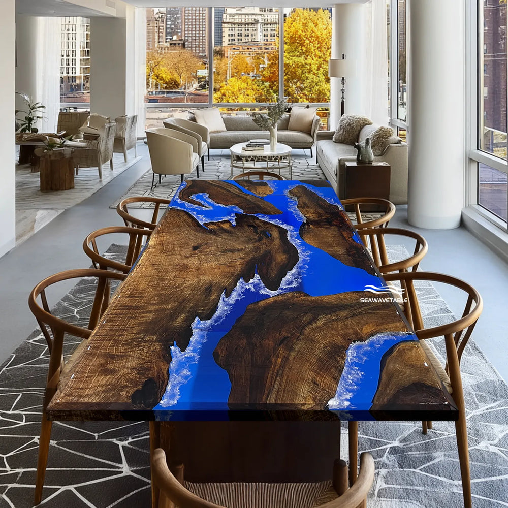 Beveled edge wood table with vivid blue resin river and wave effect finish