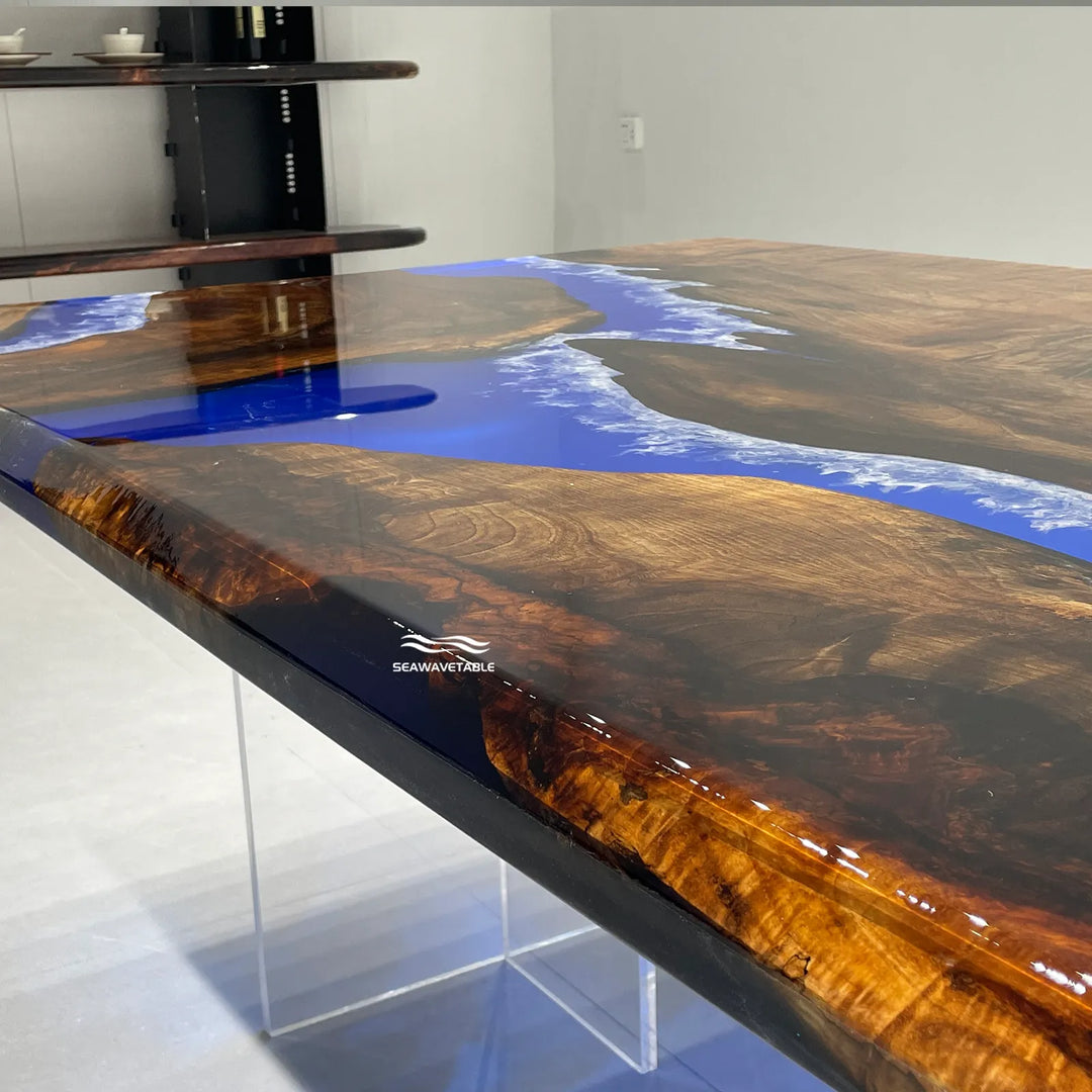 Luxury epoxy dining table with deep blue river and natural black walnut grain