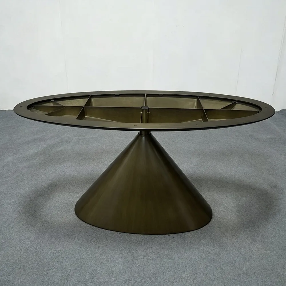 A sculptural segmented circular metal table base in dark bronze finish, featuring open cutouts and a minimalist silhouette, ideal for contemporary round tabletops - SeawaveTable