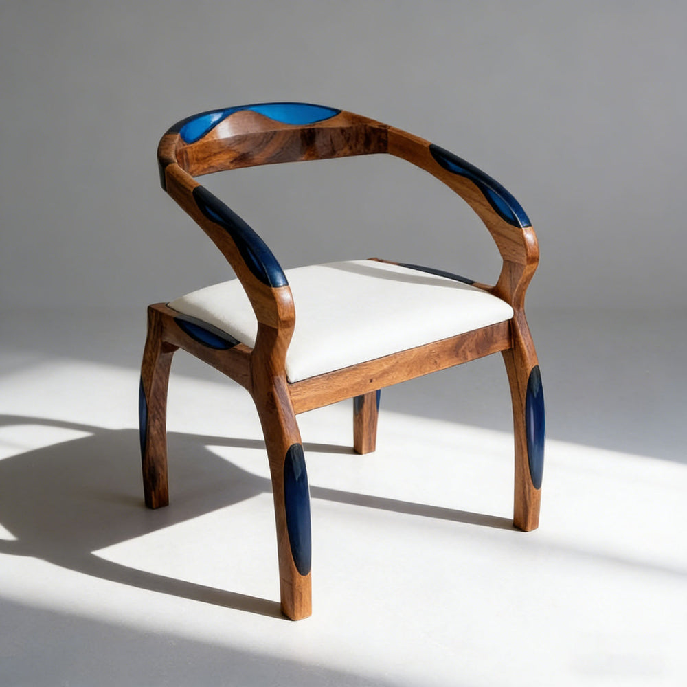 Handcrafted hardwood chair featuring ocean-inspired blue resin details