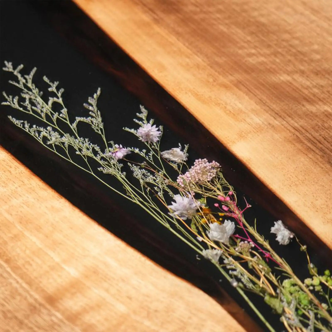 Seawavetable-Contemporary oval wood and black resin dining table with dried flora