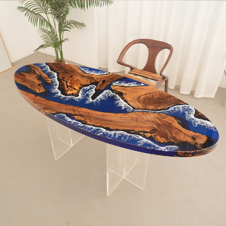 Seawavetable
Luxury dining table made from black walnut and blue resin, set for six in a warm-toned room with city view.