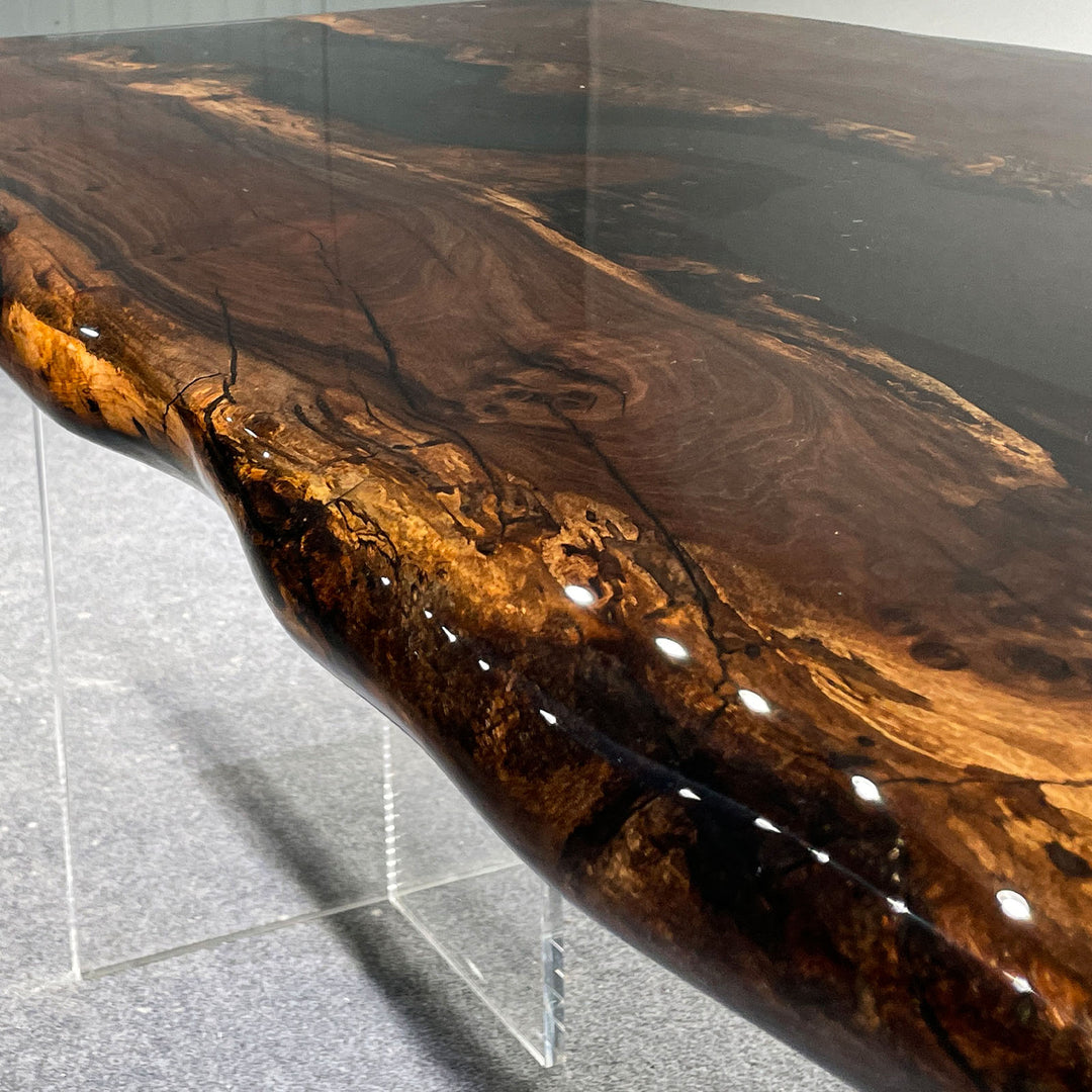 Custom black resin and walnut wood table for luxury apartments