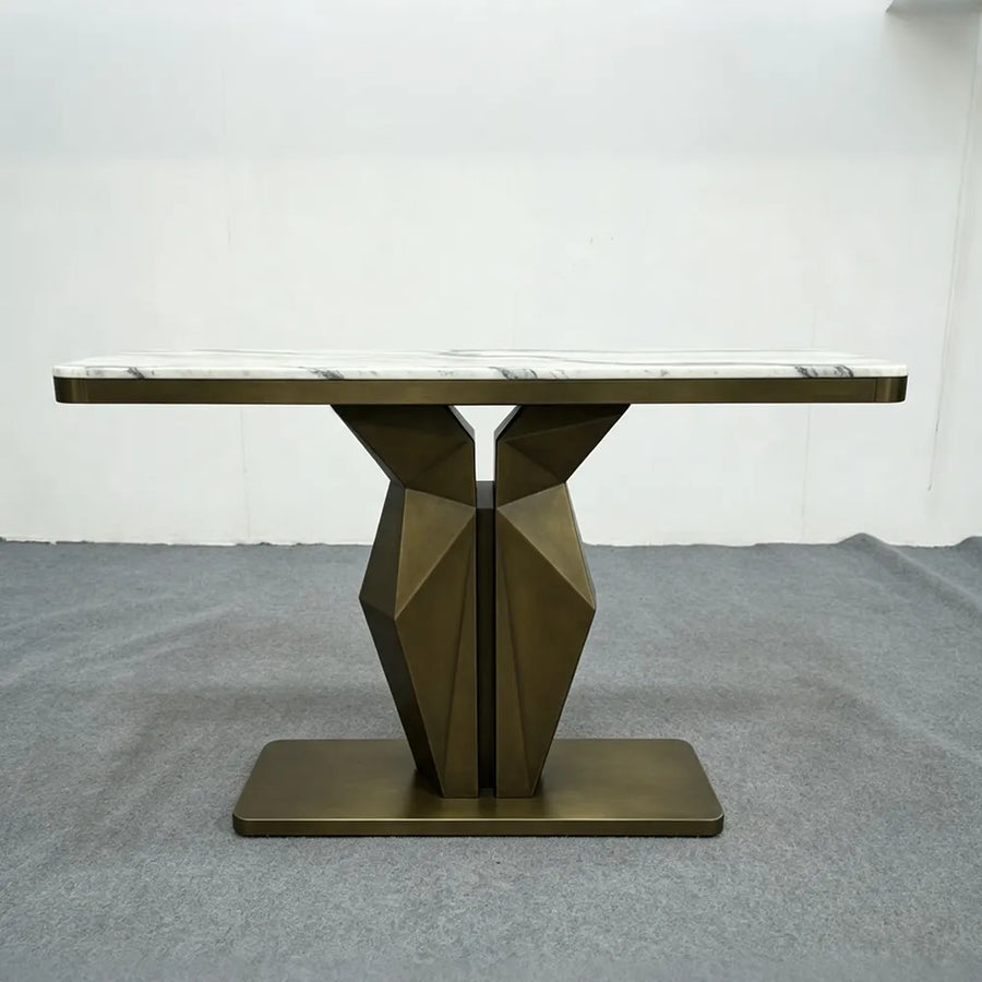 Sculptural faceted geometric metal table base with brushed bronze finish and pedestal support, 28 inches high