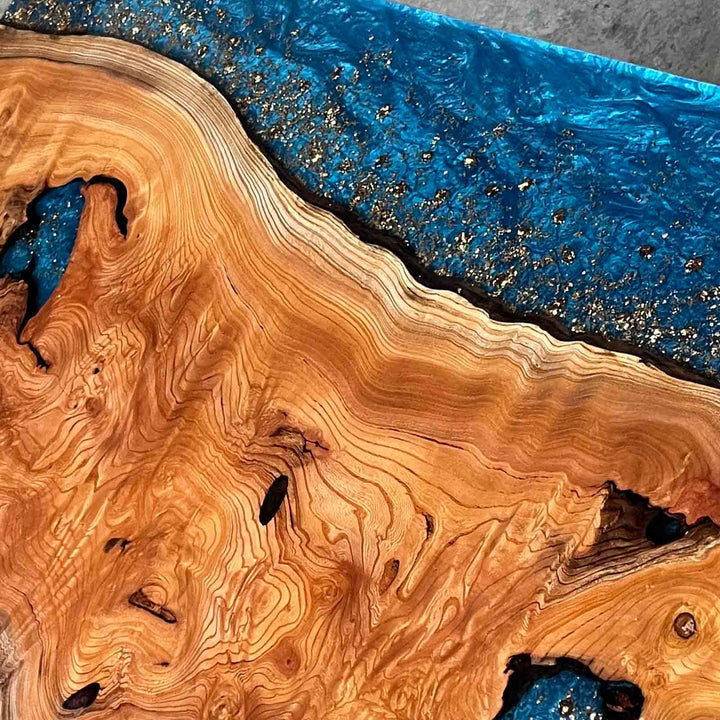 Seawavetable- High-gloss blue resin dining table with beech wood slab and gold leaf detail