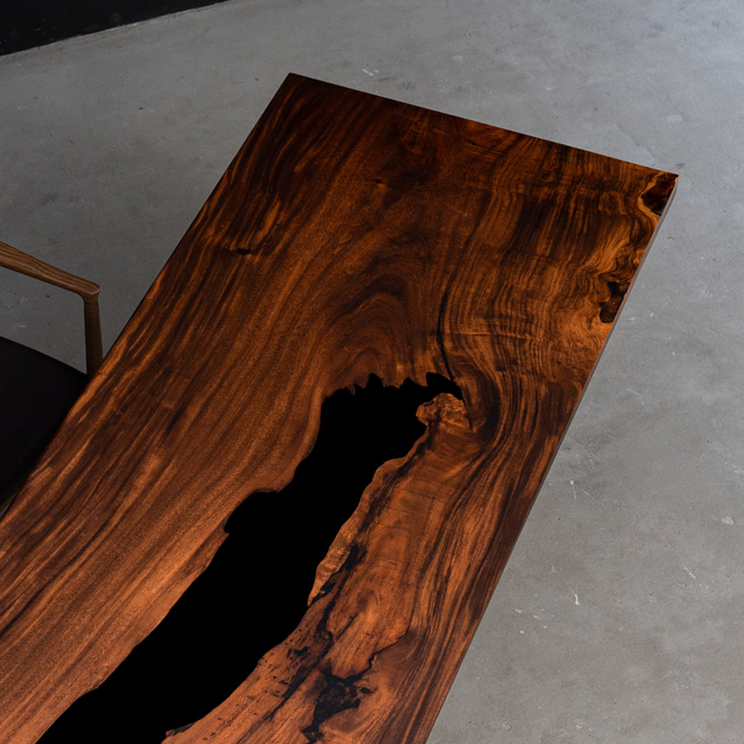 Seawavetable-close-up of walnut wood grain on a matte epoxy table surface.