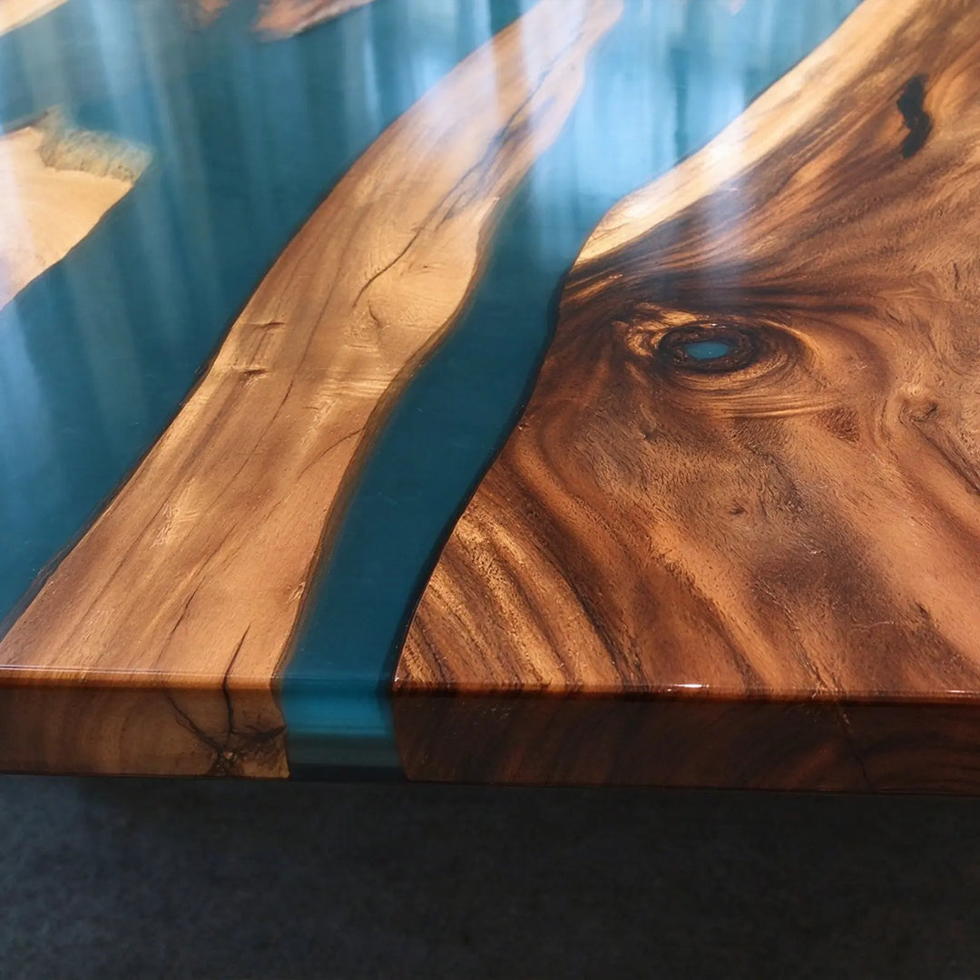 Seawavetable-Artisan made walnut wood dining table with vibrant deep blue flowing resin
