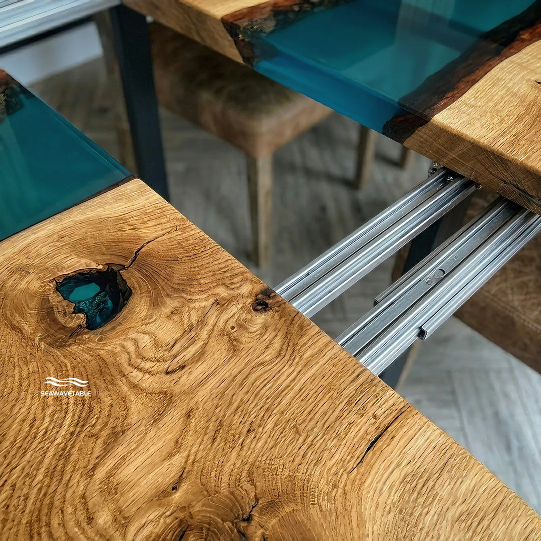 Seawavetable‑Close‑up detail black walnut epoxy table, natural dark wood grain meeting high‑gloss transparent blue epoxy resin river
