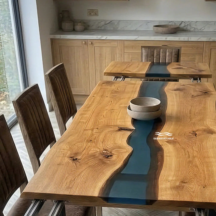 Seawavetable‑Black walnut wood grain texture detail on expandable dining table, paired with flowing blue epoxy river in straight‑edge design