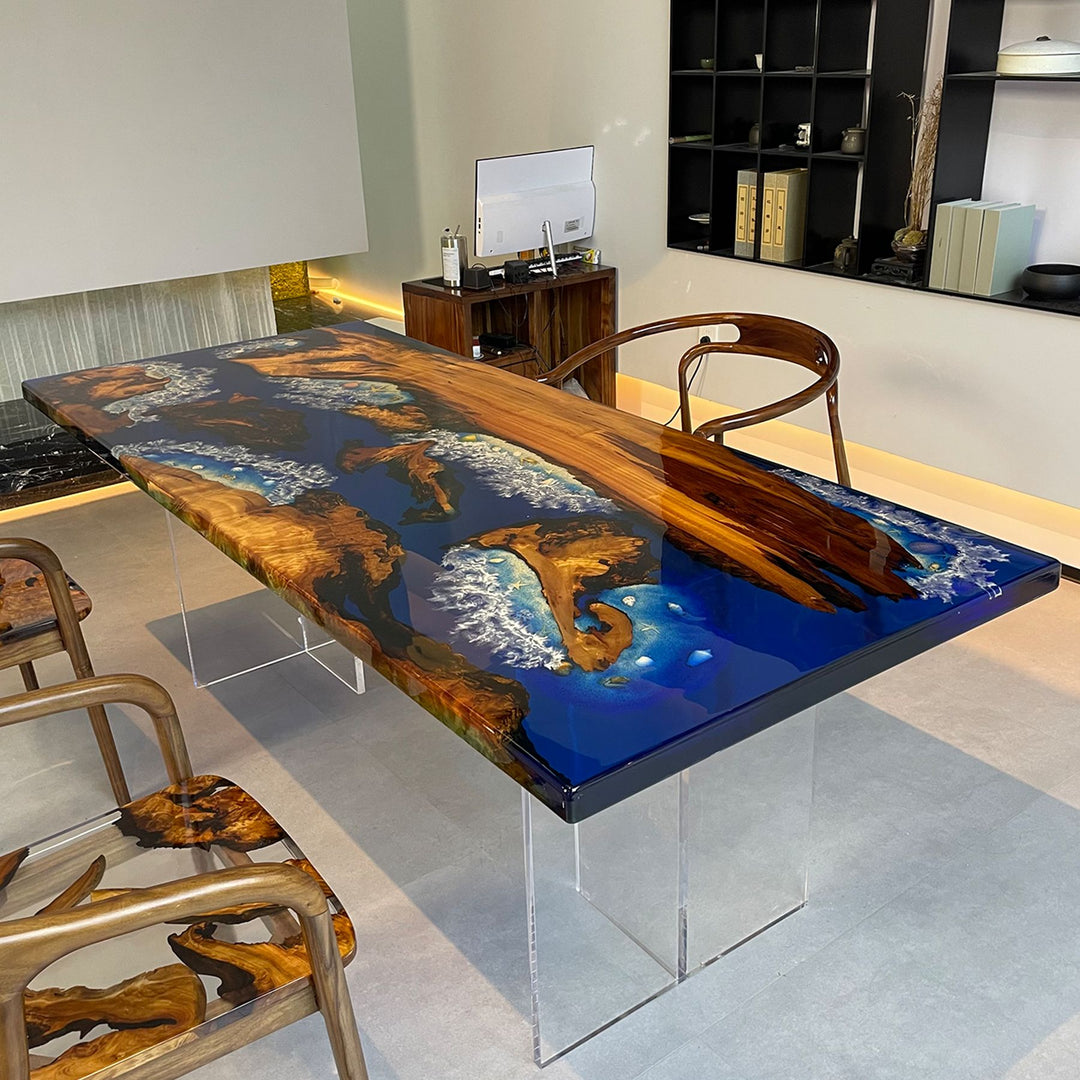 A resin - topped wooden table with a striking ocean - themed design, accompanied by matching wooden chairs.