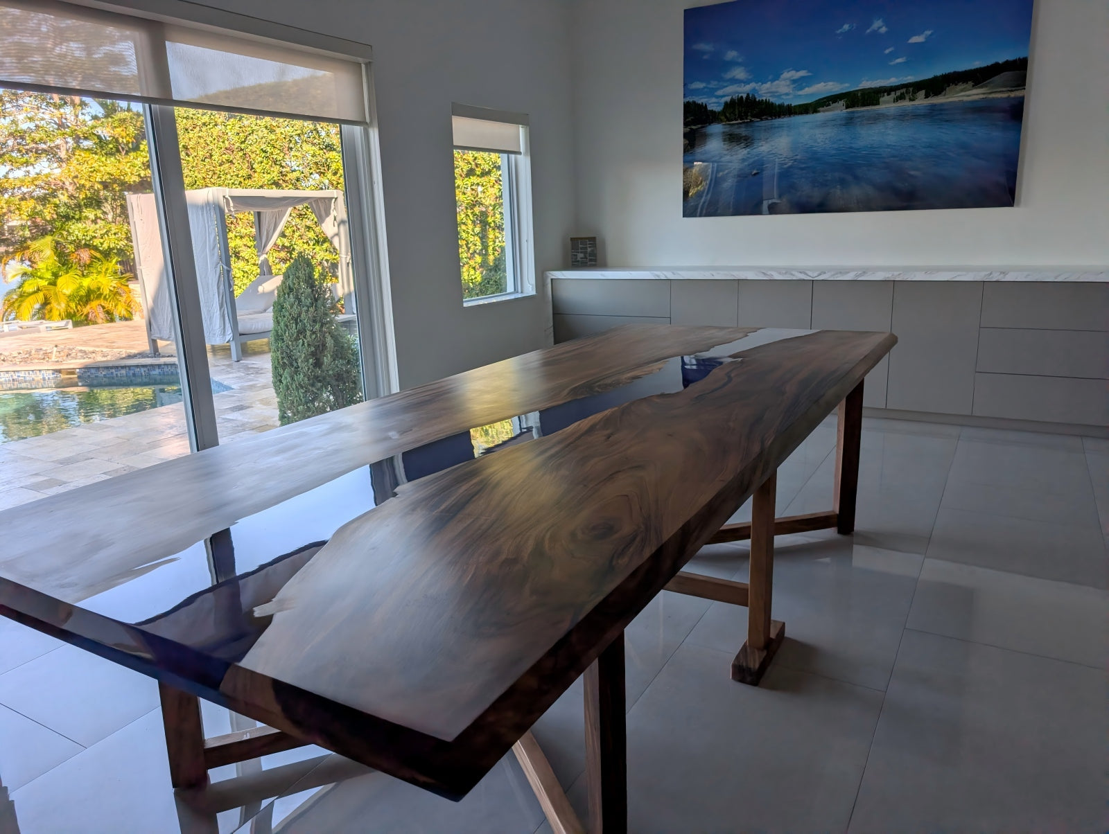 Close-up customer photo showcasing the deep ocean blue epoxy and matte walnut wood grain.