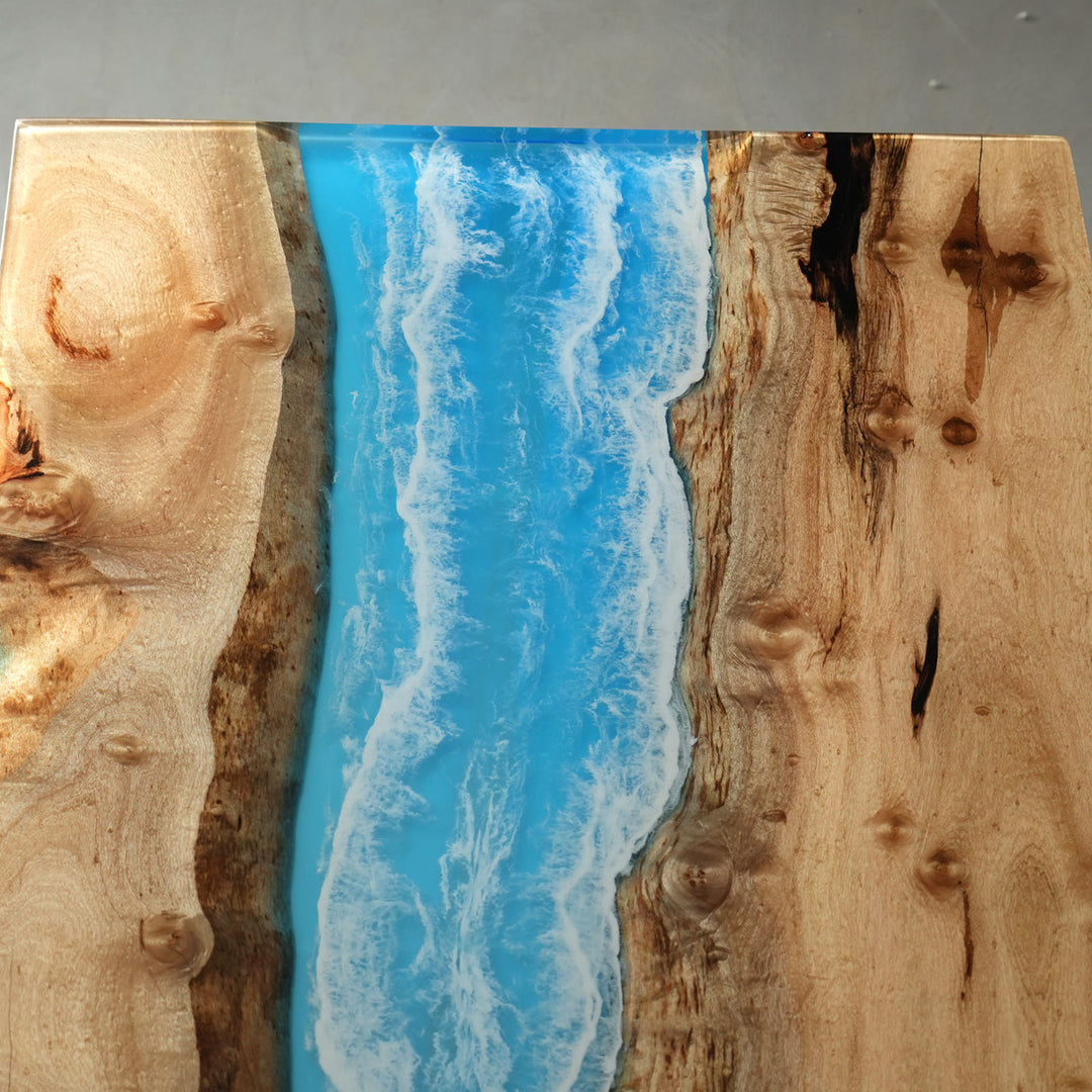 Contemporary golden camphor dining table with blue resin details