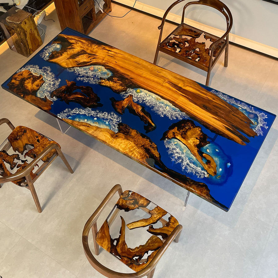 A resin - topped wooden table with a vivid ocean - themed design