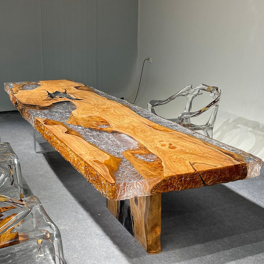 Olive wood and resin table with clear resin - like chairs, measuring 137.8" x 39.37" x 4.33"