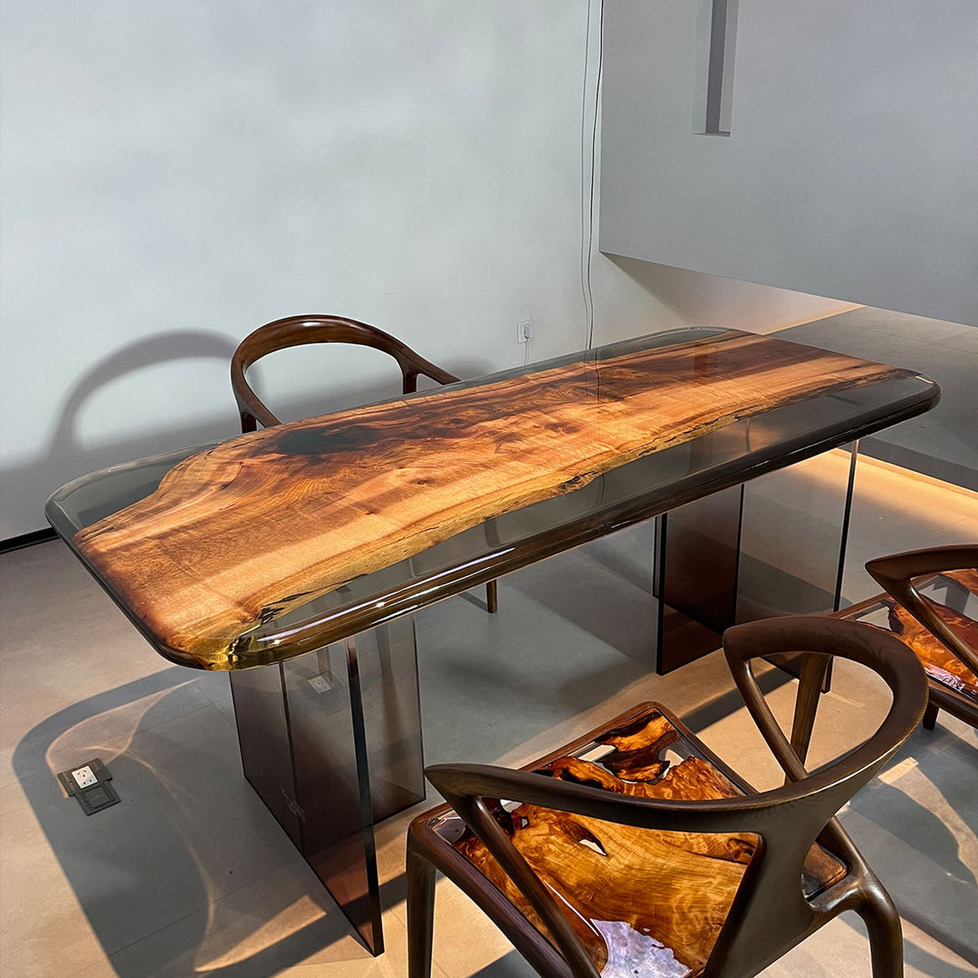 A resin - finished wooden table paired with stylish chairs, showcasing natural wood grain patterns.