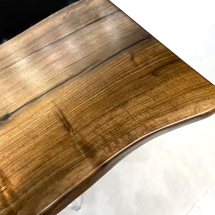 Luxury condo dining table featuring black epoxy river design