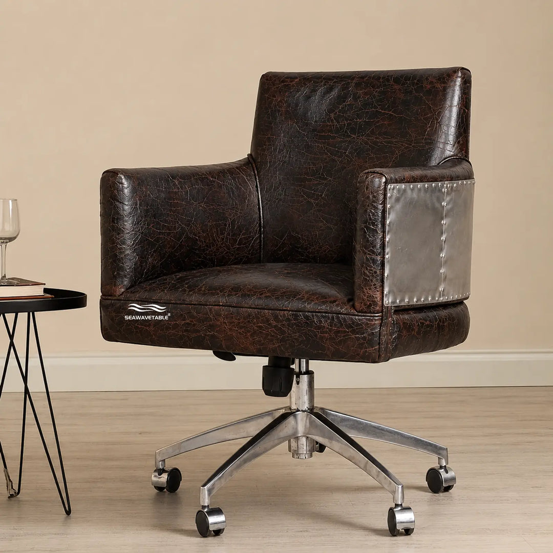 Vintage-style leather desk chair with polished five-star metal base and black casters