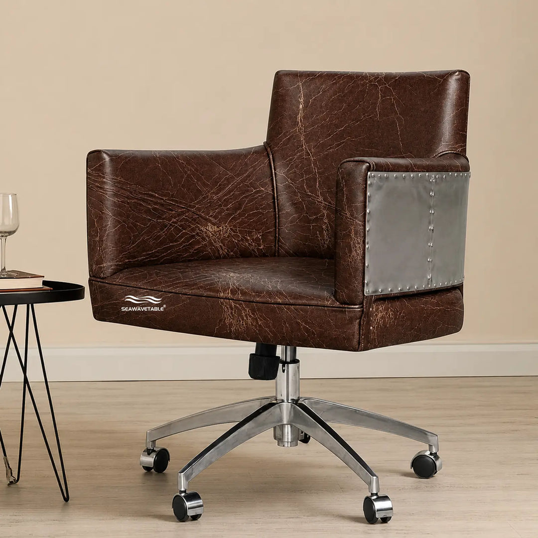 Vintage leather office chair with cushioned seating, riveted metal details, and rolling base