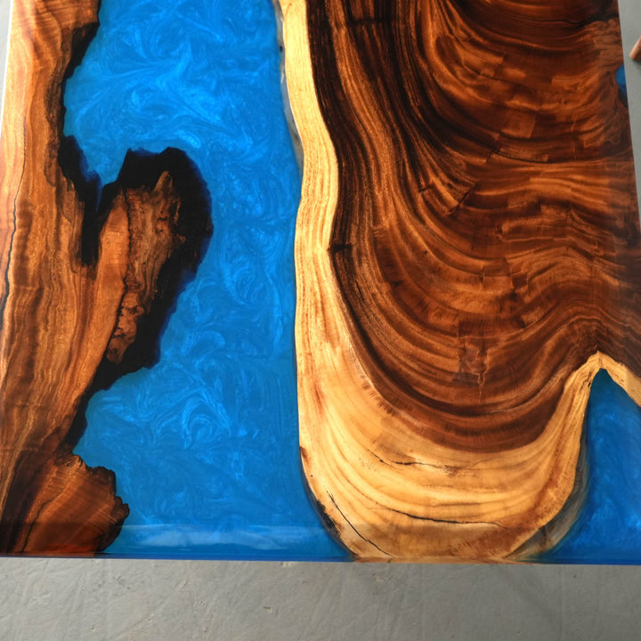 Resin walnut dining room table detail showing smooth epoxy table finish, unique grain patterns, and handcrafted surface design - SeaWaveTable