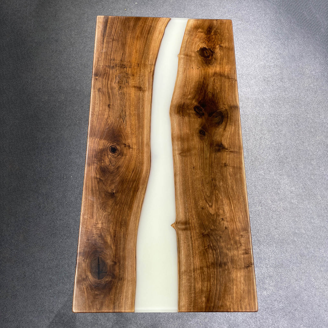Elegant console table in white epoxy with dark resin accents