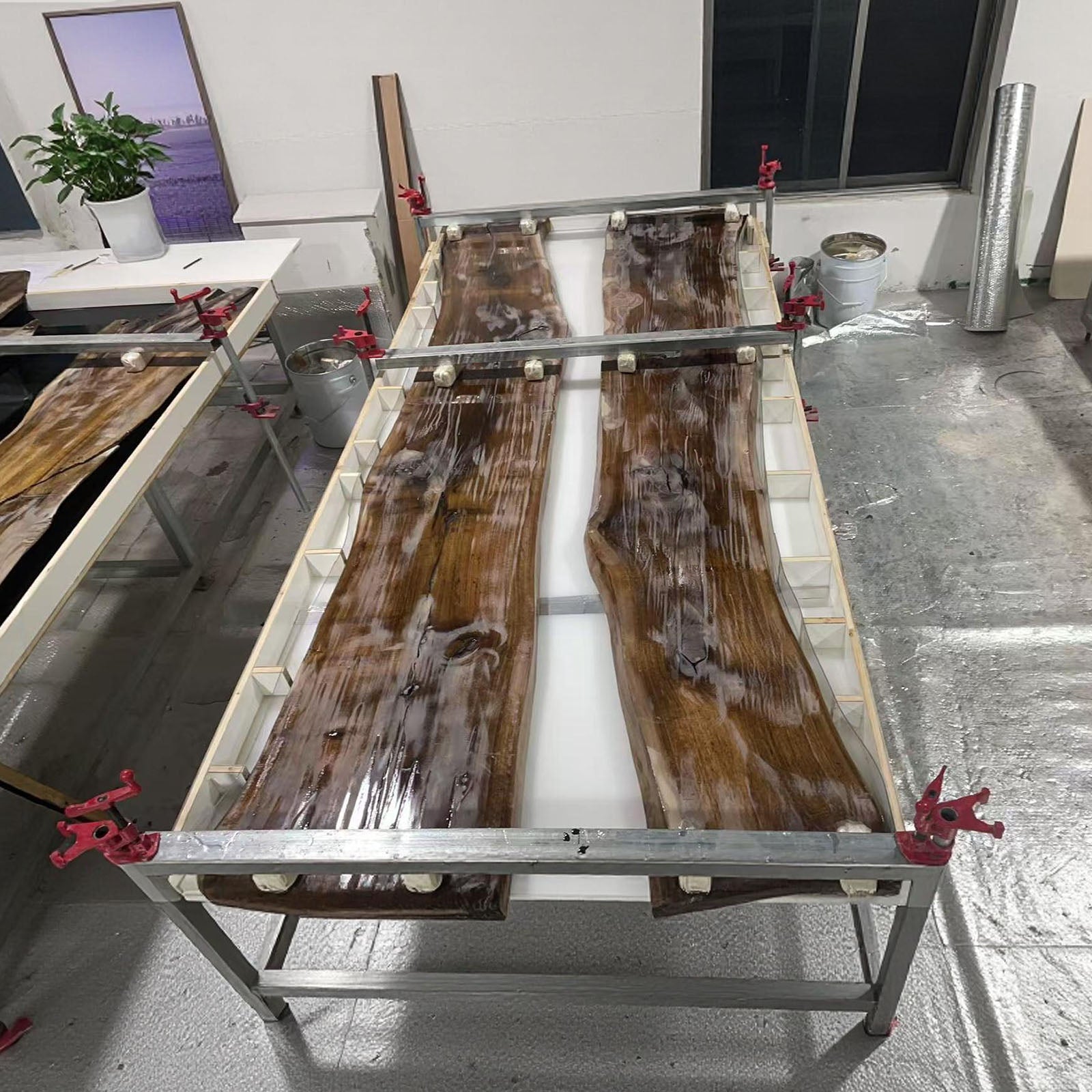 Large black walnut conference table featuring a deep black epoxy river, perfect for executive offices.