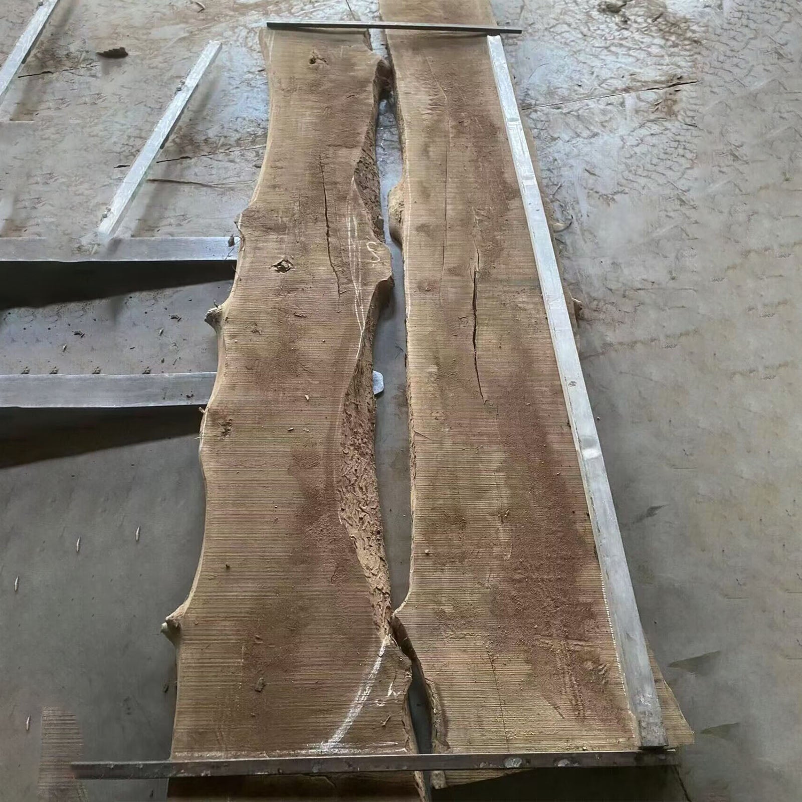 Handmade black walnut dining table with a bold black epoxy river and natural white sapwood edges