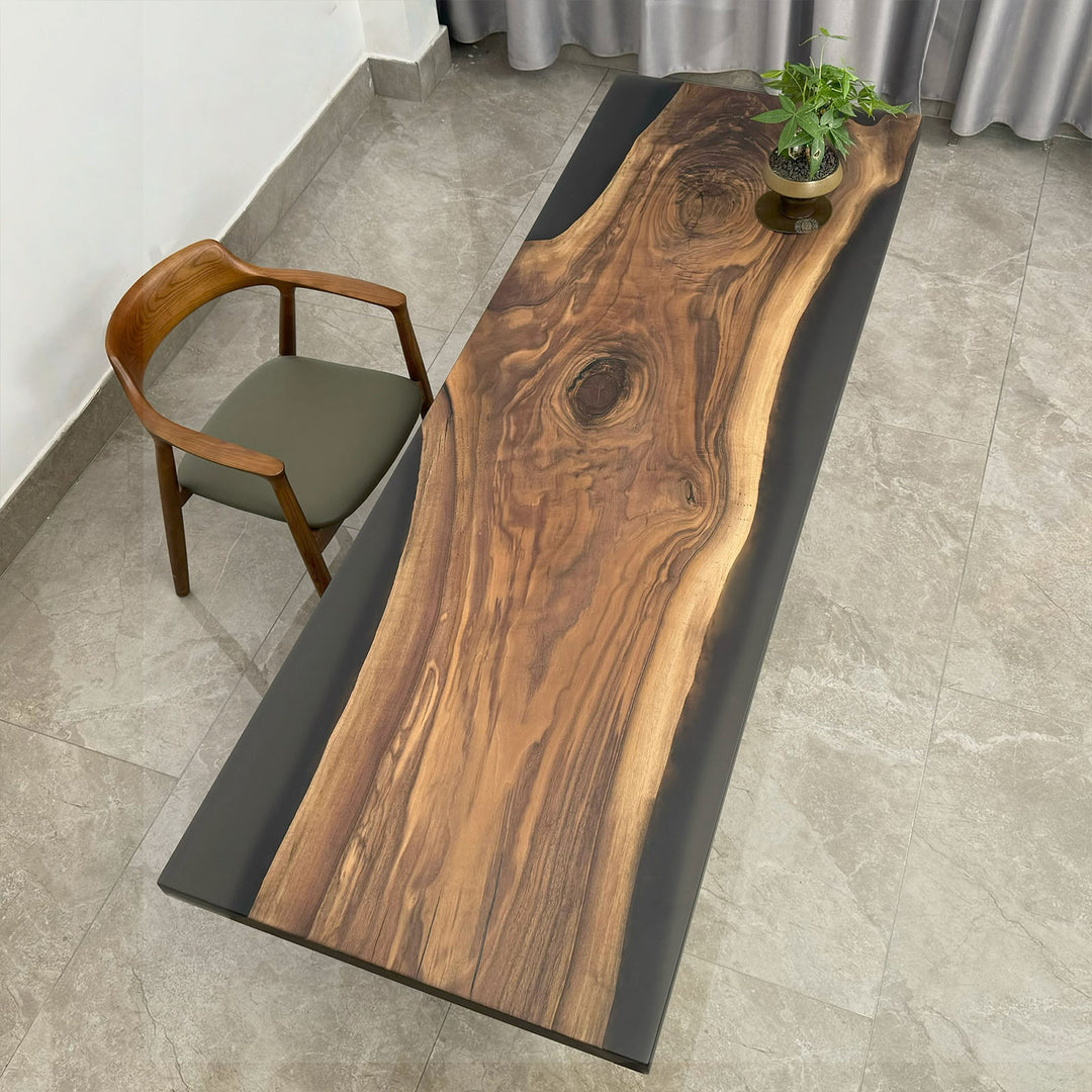 Black walnut dining table with semi-transparent black epoxy and matte finish