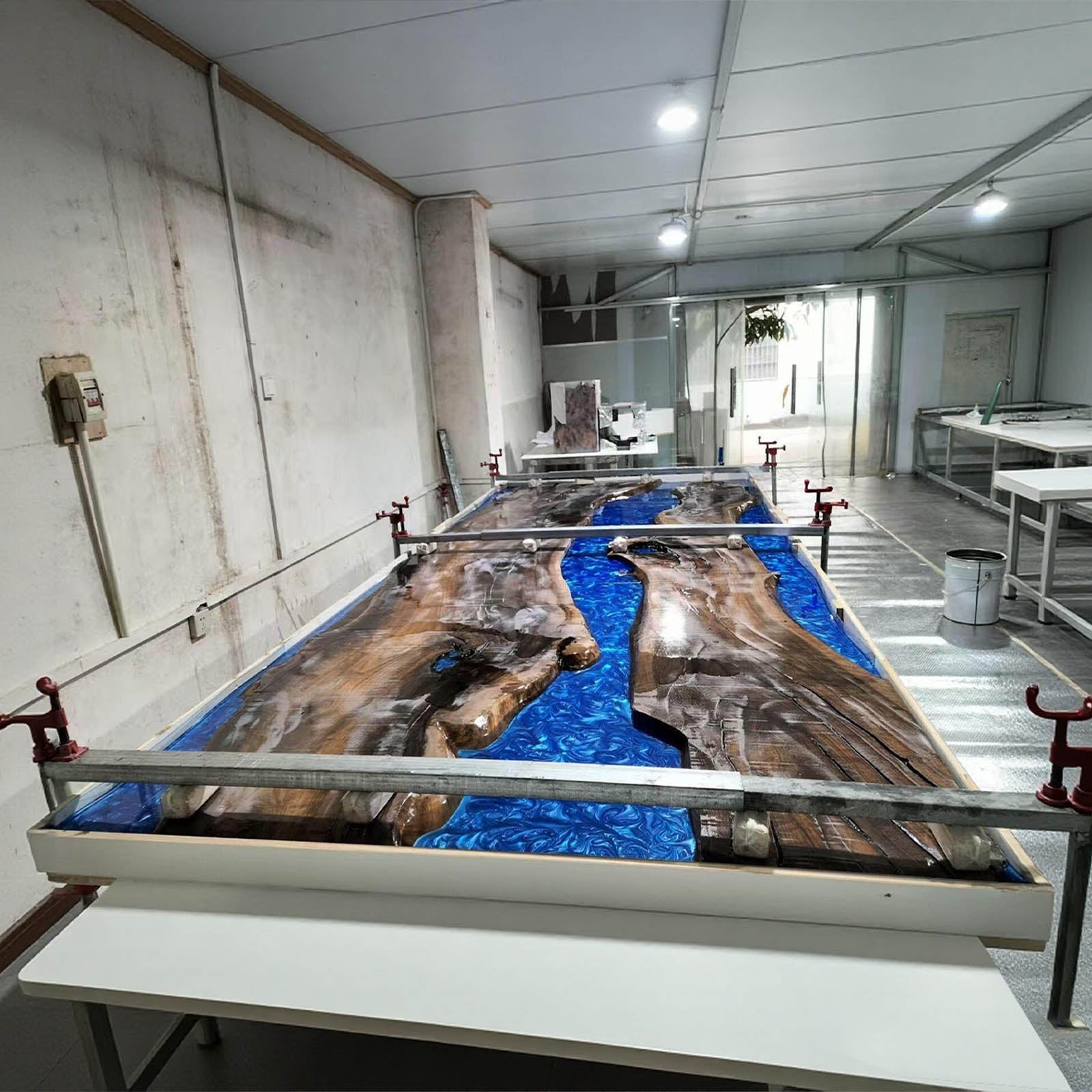 Modern console table crafted from black walnut and ocean blue epoxy, perfect for entryways or hallways.