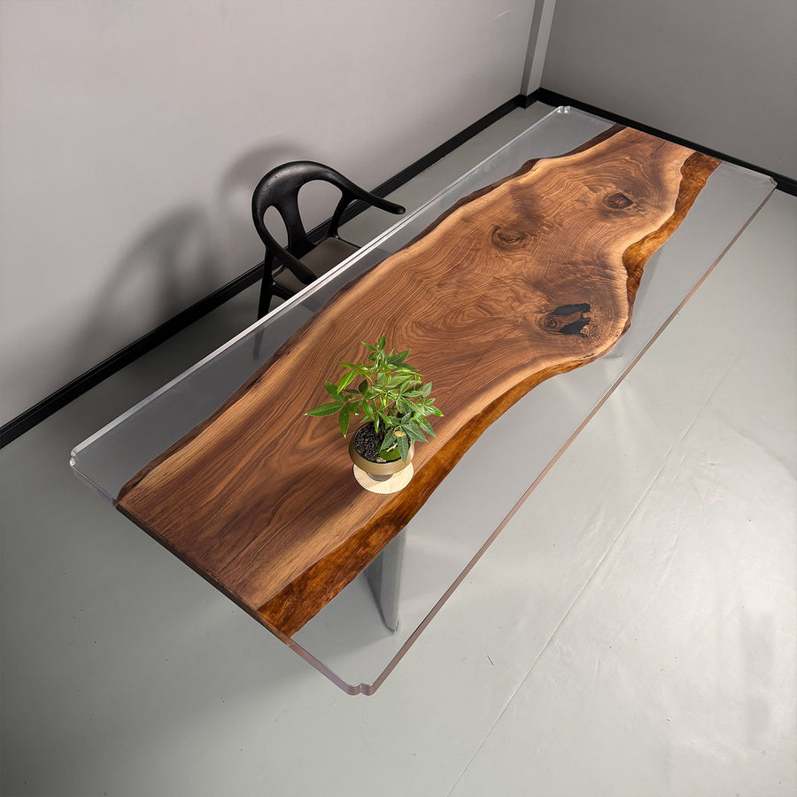 Close-up of black walnut table with crystal-clear epoxy river and matte finish