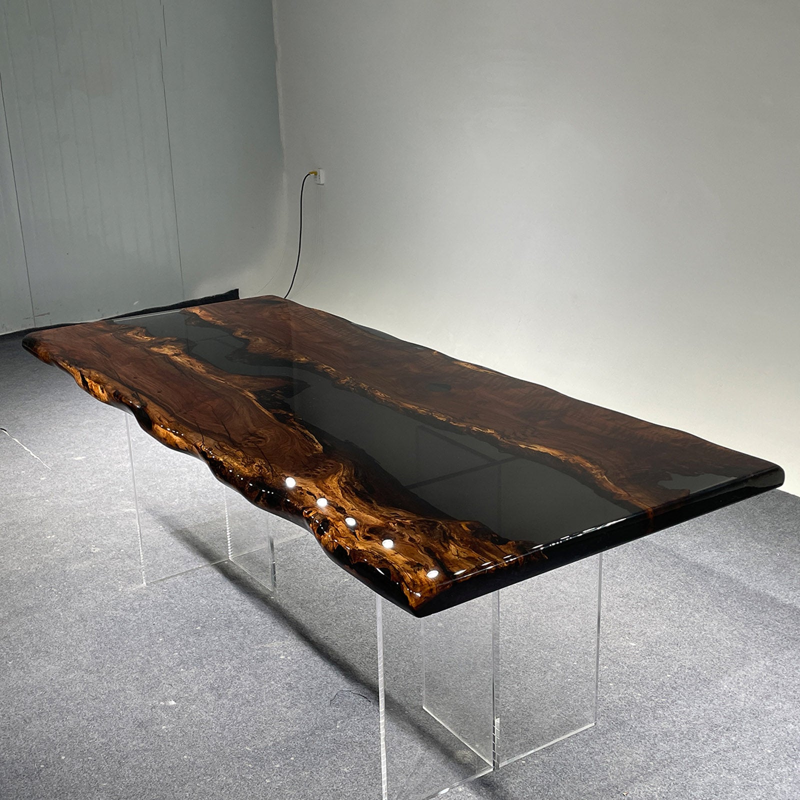 Handcrafted table thickness detail highlighting solid black walnut durability and resin clarity