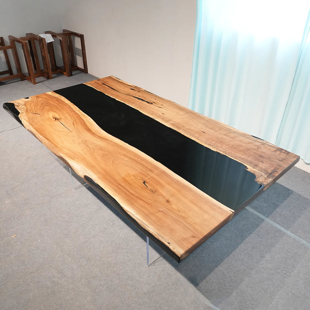 Black Walnut dining table with irregular black epoxy sections by SeawaveTable