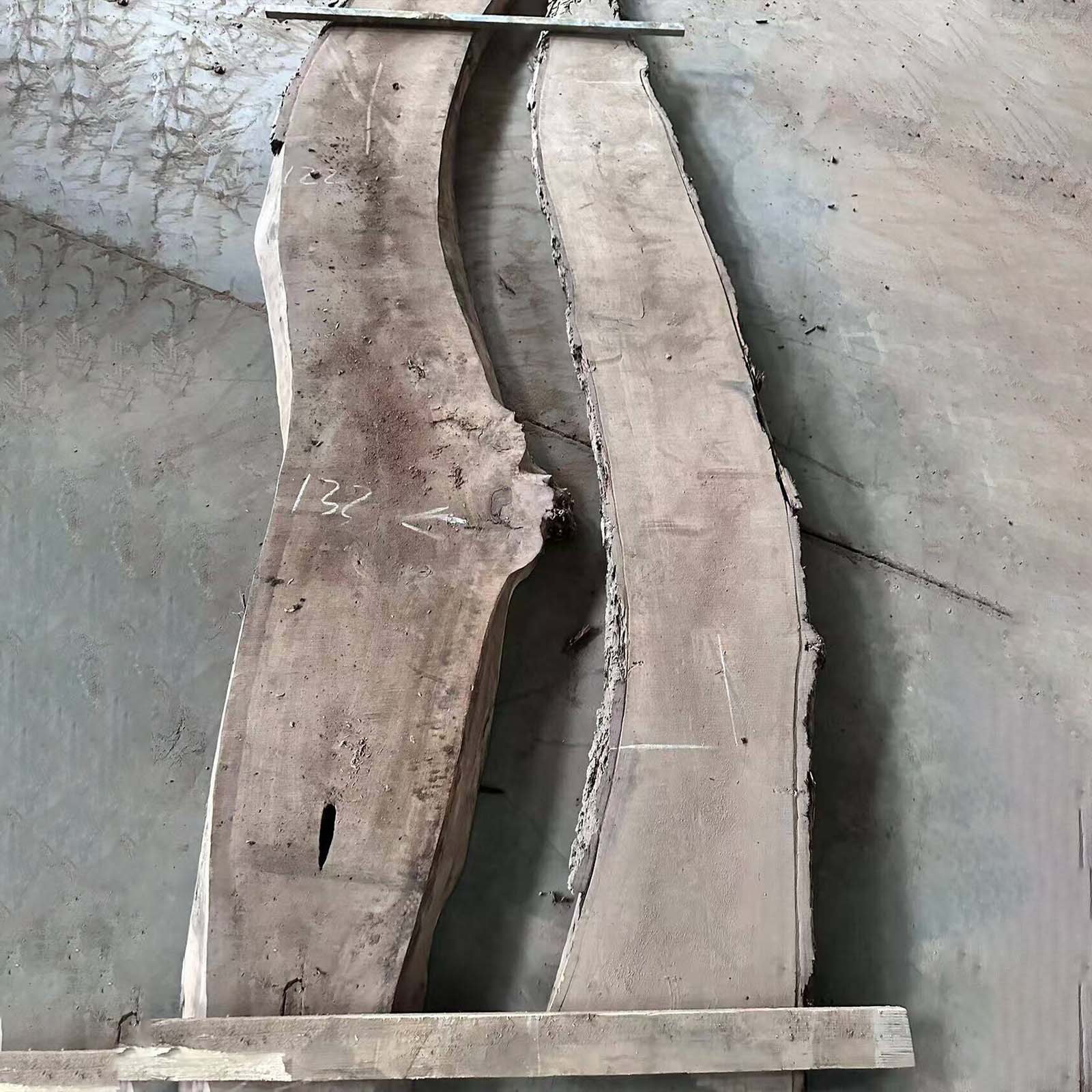 Top view of live edge black walnut river table with swirling ocean blue resin and integrated LED lighting for office or dining use.