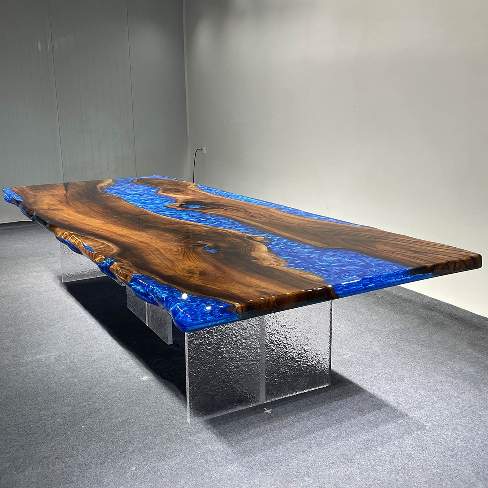 Luxury ocean blue epoxy river table made from premium black walnut with a glossy resin surface.