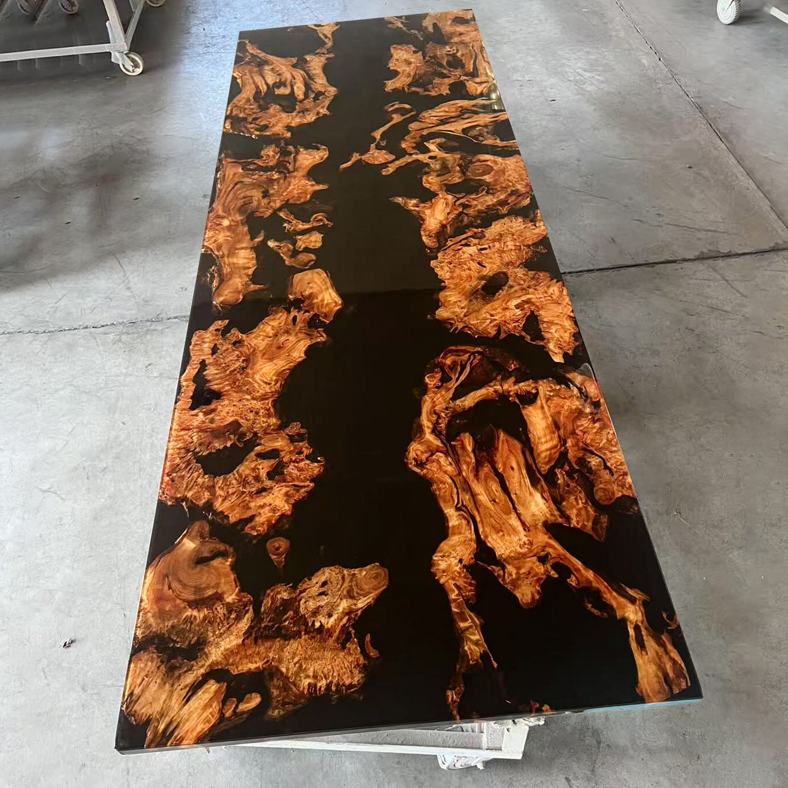 Natural white sapwood edge detail contrasting beautifully with dark black epoxy resin