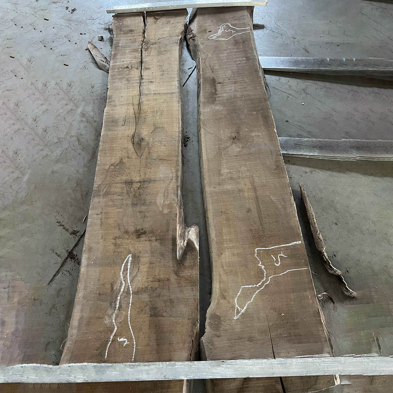 Straight-edge craftsmanship detail on black walnut table with clean epoxy river alignment