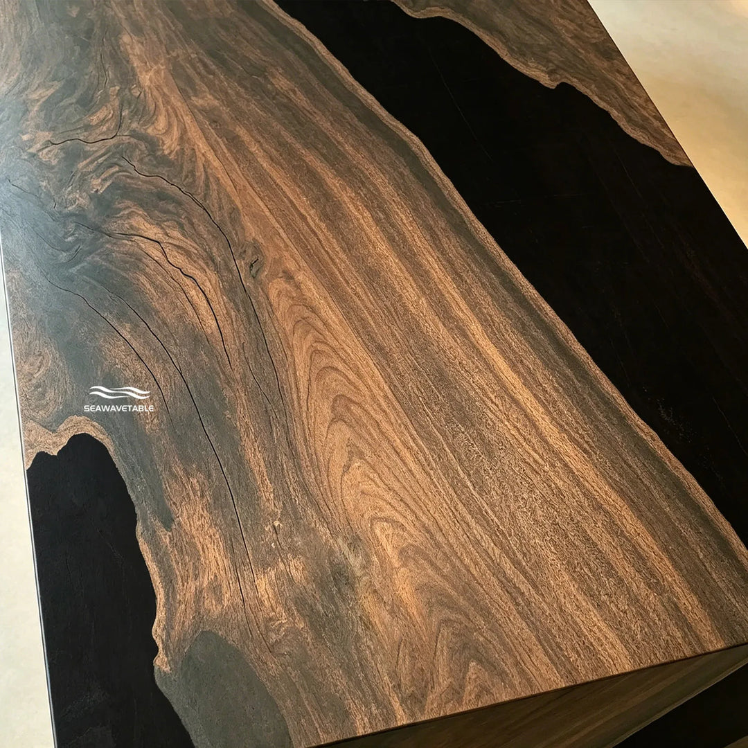 Side view of black walnut epoxy waterfall table with continuous grain