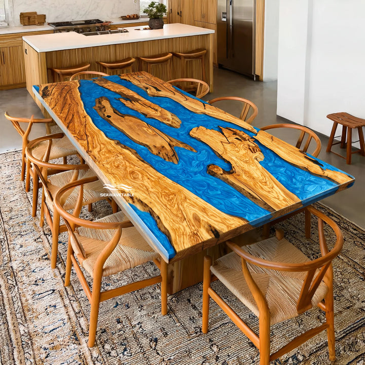 Side profile of straight edge olive wood epoxy river table with high-gloss blue resin finish