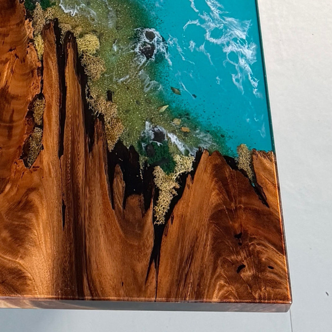 Walnut ocean blue resin river table with stone inlay styled in a modern coastal interior