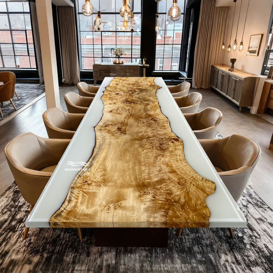 Dining room with a large wooden table and chairs in a modern interior setting.