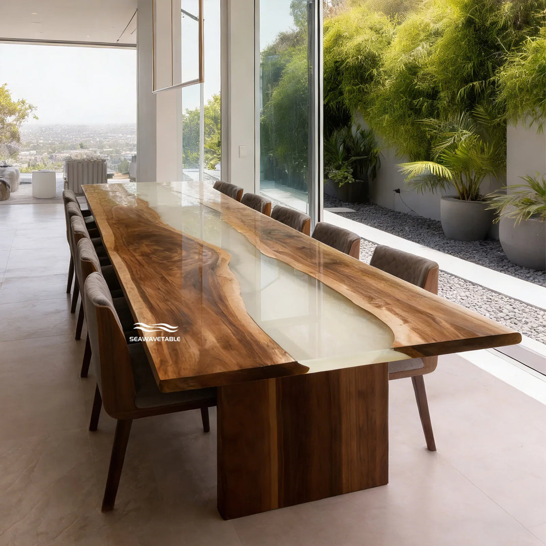 Modern dining room featuring cream white epoxy river table with walnut slabs